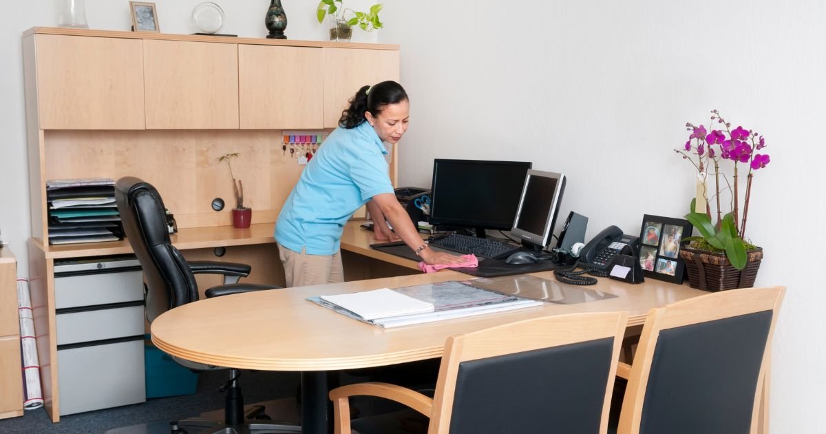 A group of people cleaning an office.